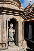 Bangkok Wat Arun - Details of the statues of Chinese saints of the pagoda at the corners of the Ubosot coutyard. 